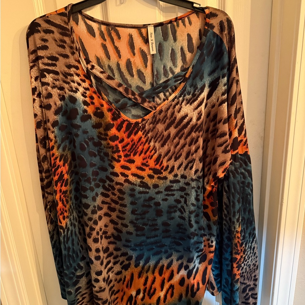 Vibrant Animal Print Blouse with Crisscross Neckline